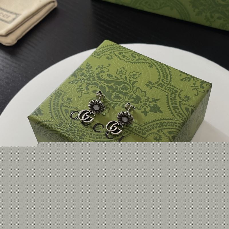 G*u*i earrings